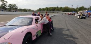Lauren Butler and her team helping to launch a stock car