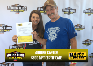 Johnny Carter holding an Autometer $500 gift certificate