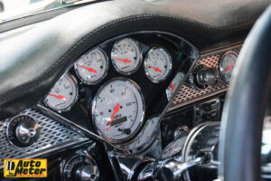 Autometer dials nested into the dash of a car