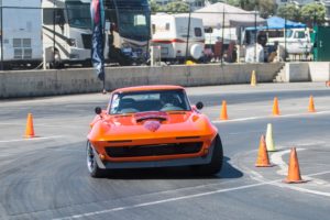 Corvette turning a corner on a track